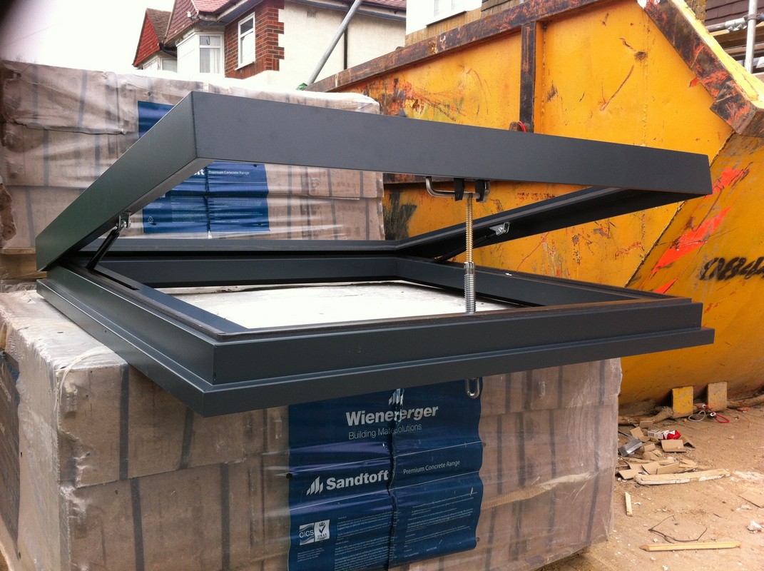 Opening flat roof skylight in anthracite grey installed in Balham